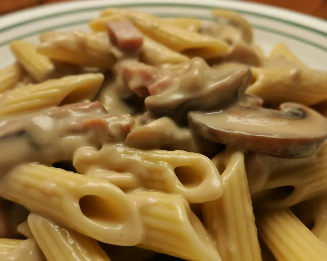 Delicious creamy mushroom stroganoff served over egg noodles with fresh herbs.